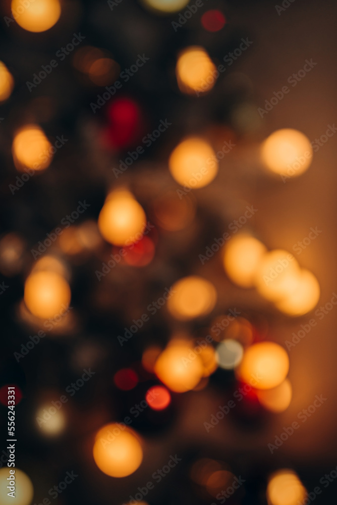 Warm golden lights of christmas tree blurred bokeh on dark background. Warm golden lights of christmas tree blurred bokeh on dark background.