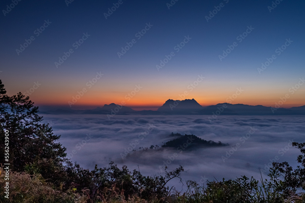 Obraz premium Majestic view of Doi Luang Chiang Dao in northern Thailand, the third highest mountain in Thailand, seen with beautiful dramatic clouds and colorful sky