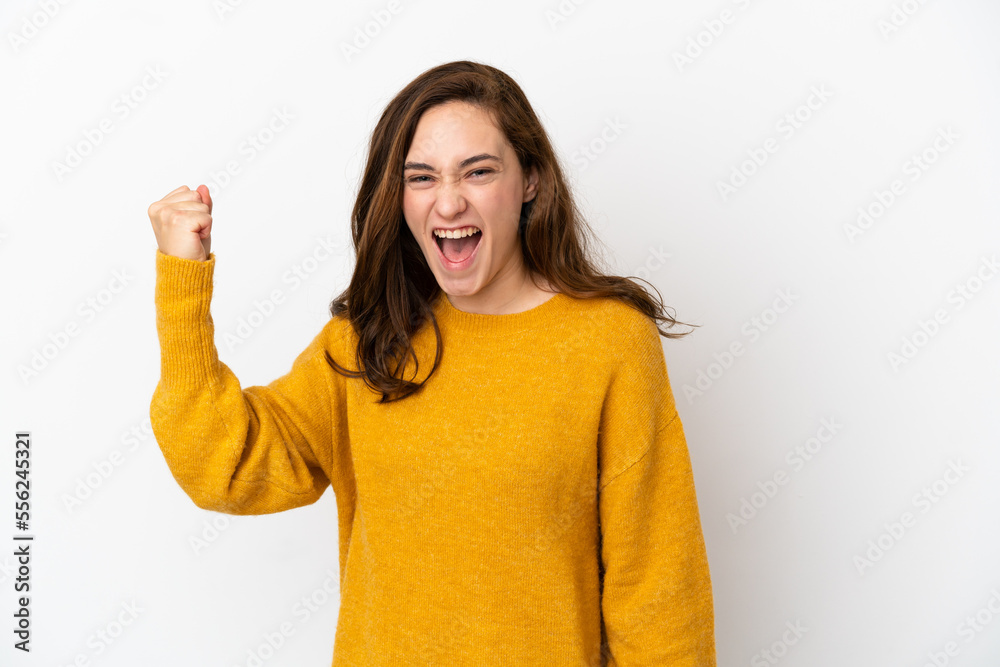 Young caucasian woman isolated on white background celebrating a victory