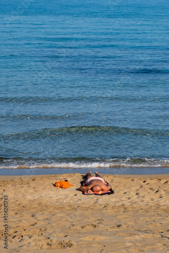 Caucasian man sleeping and relaxing on the shore. Summer holidays at beach