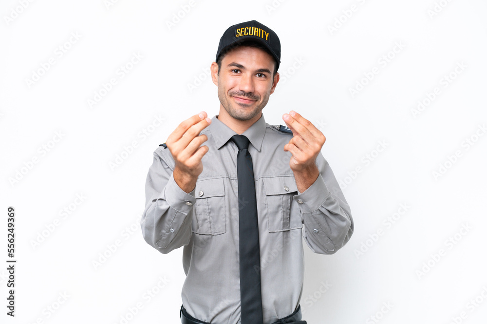 Young safeguard man over isolated white background making money gesture