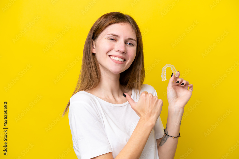 Young English woman holding invisible braces proud and self-satisfied Young English woman holding invisible braces proud and self-satisfied
