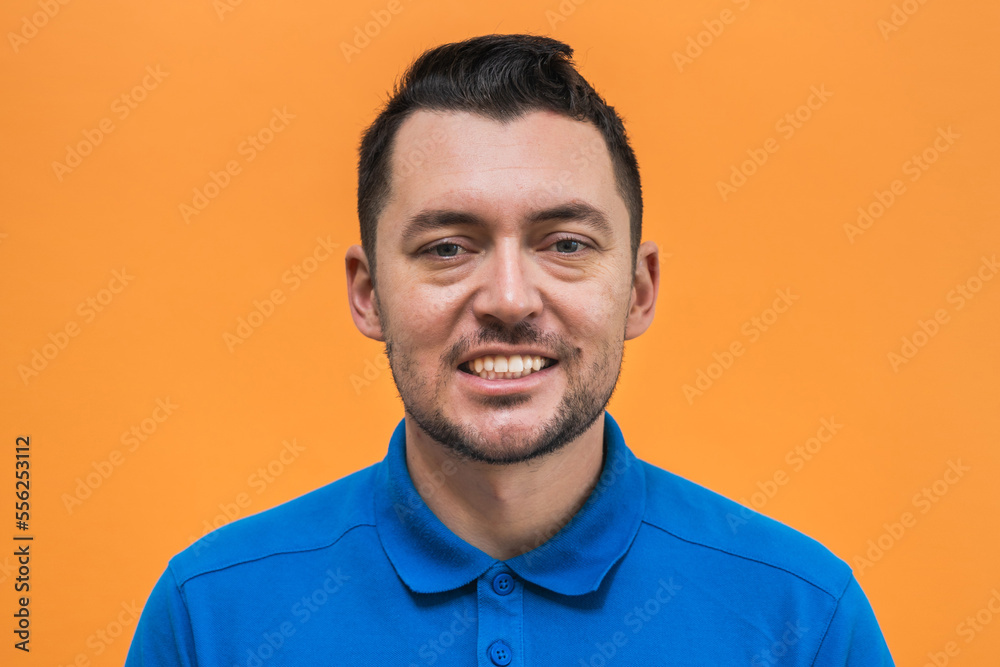 Portrait of the man on orange background. Man's emotions Portrait of the man on orange background. Man's emotions