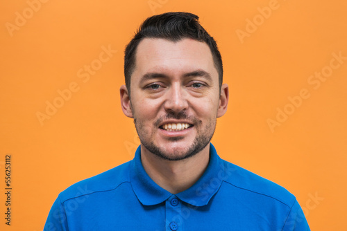 Portrait of the man on orange background. Man's emotions © Anton Tolmachov