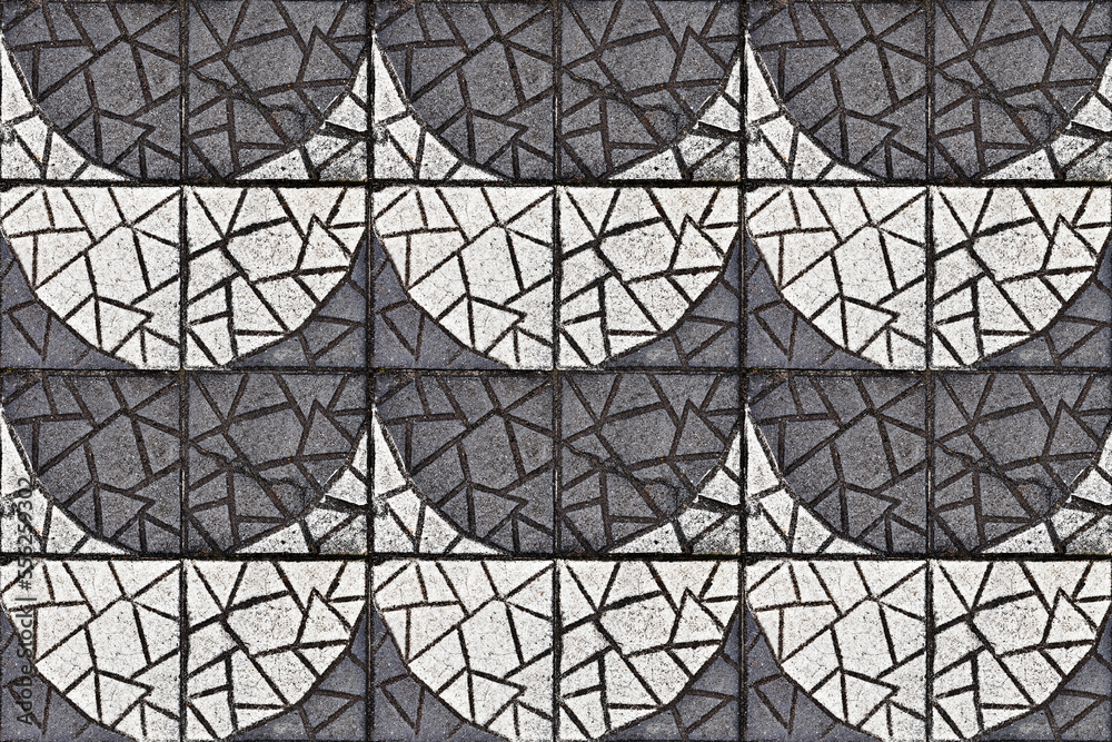 Black and white textured concrete blocks on floor Black and white textured concrete blocks on floor