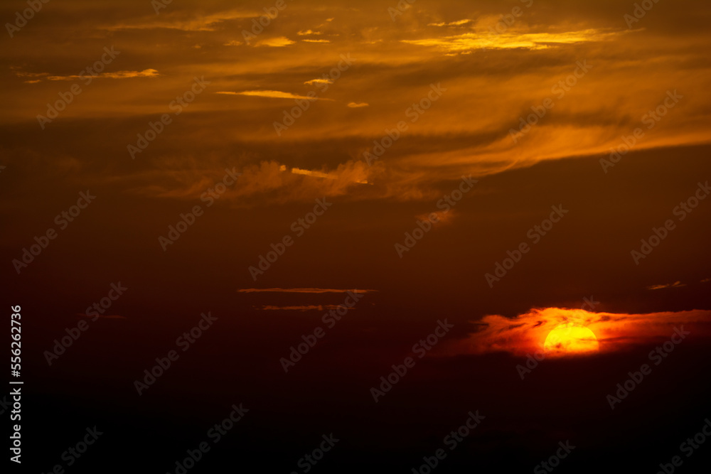 Dramatic colorful sunset sky with clouds over the mountains Dramatic colorful sunset sky with clouds over the mountains
