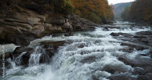 Beautiful and powerful waterfall of Ukrainian Carpathians. Probiy waterfall on Prut River in Yaremche City, western Ukraine. Cinema 4K 60fps one minute relax video with sound of water