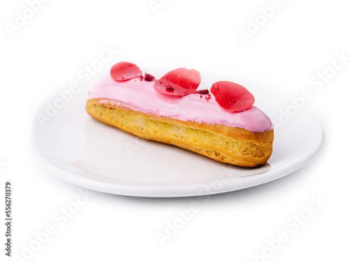 eclairs with pink raspberry glaze on white plate