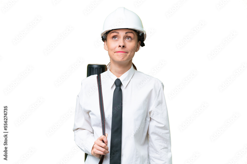 Young architect woman with helmet and holding blueprints over isolated background and looking up Young architect woman with helmet and holding blueprints over isolated background and looking up