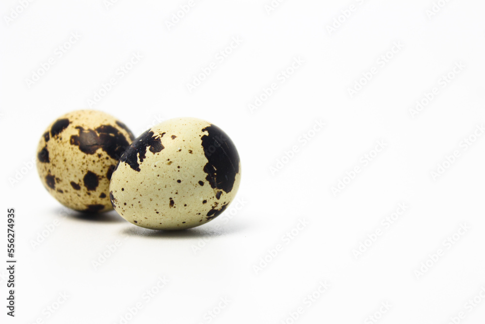 Quail Eggs Kissing Each Other, Pareidolia Effect on Quail eggs. Isolated on White. Right  copy space
