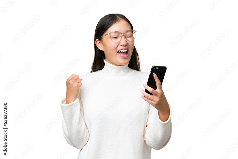 Young Asian woman over isolated background with fingers crossing and wishing the best Young Asian woman over isolated background with fingers crossing and wishing the best