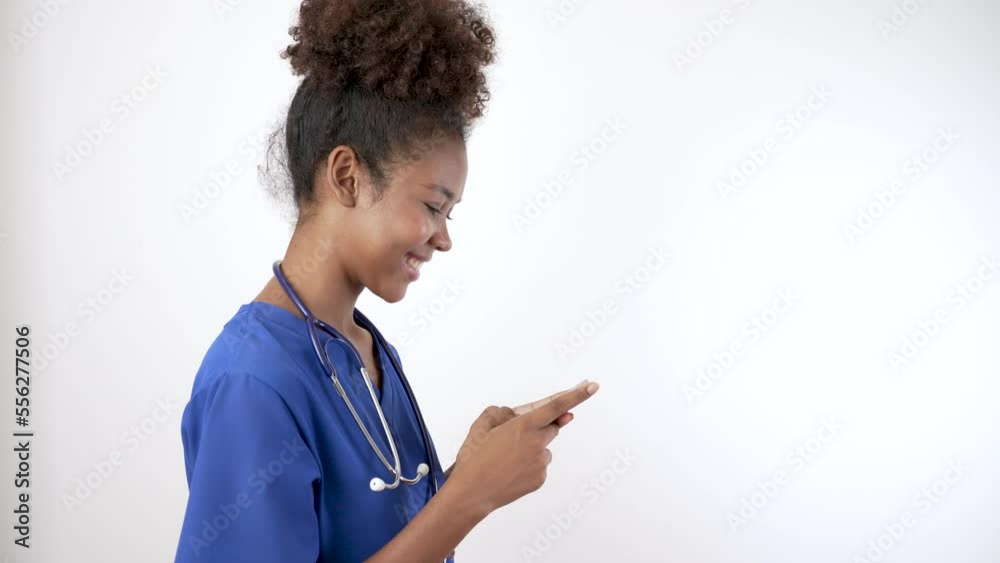 Doctor nurse black woman in blue uniform using smartphone to send text message. 5G Technology Doctor nurse black woman in blue uniform using smartphone to send text message. 5G Technology