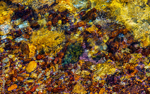 smooth clear water float on colored stone