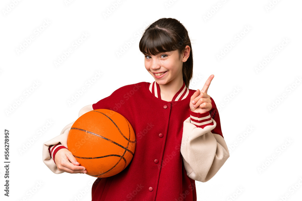 Little caucasian girl playing basketball over isolated background showing and lifting a finger in sign of the best