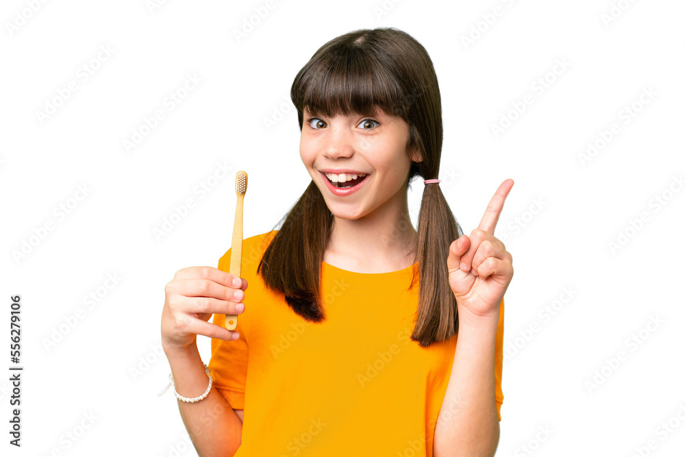 Little caucasian girl brushing teeth over isolated background pointing up a great idea Little caucasian girl brushing teeth over isolated background pointing up a great idea