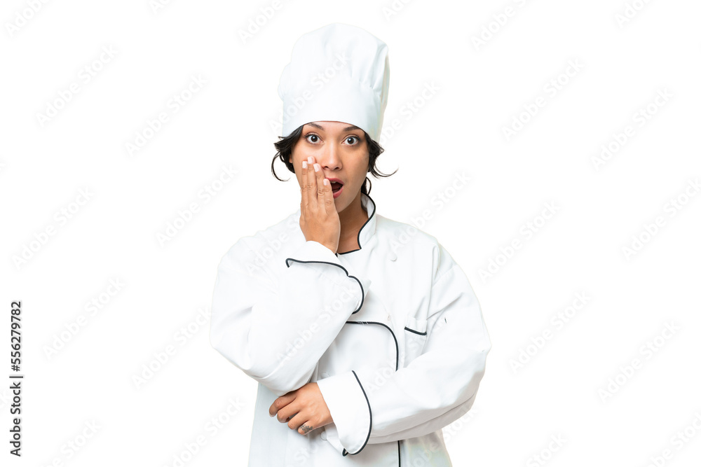 Young chef Argentinian woman over isolated background surprised and shocked while looking right Young chef Argentinian woman over isolated background surprised and shocked while looking right