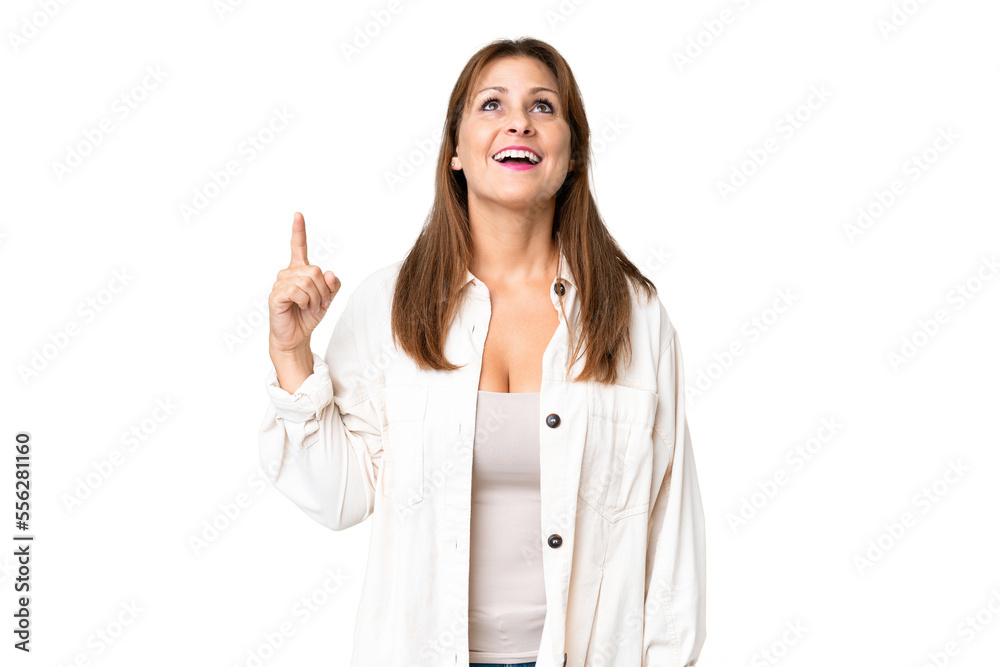 Middle age woman over isolated background pointing up and surprised Middle age woman over isolated background pointing up and surprised