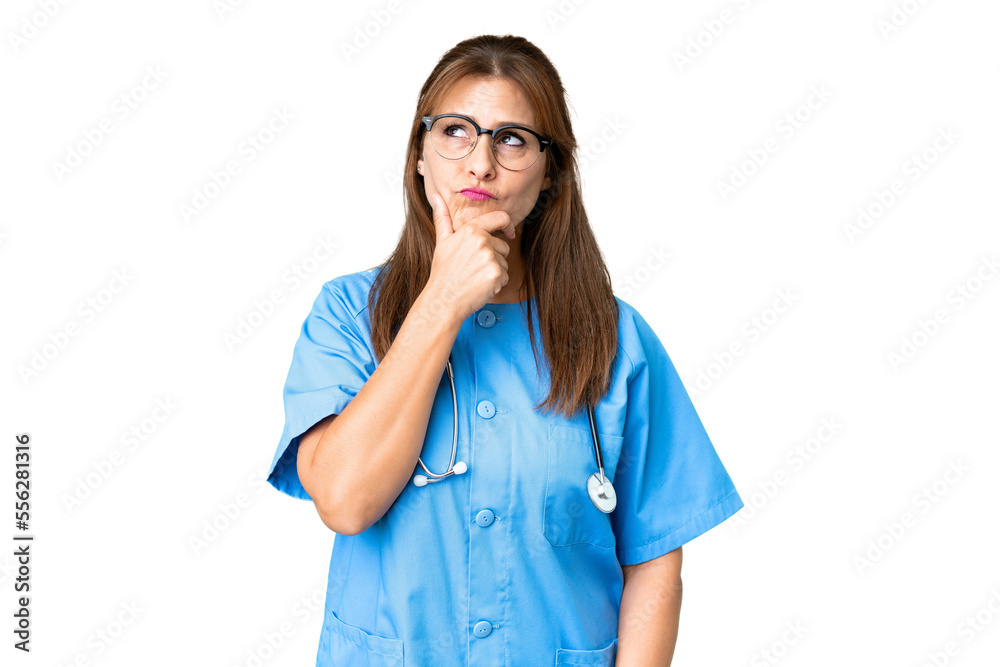 Middle age nurse woman over isolated background having doubts and with confuse face expression