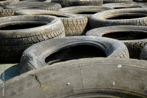 A closeup of old dirty tires with sunlight