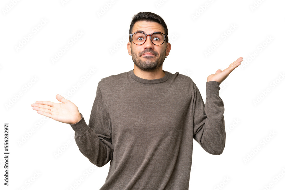 Young handsome caucasian man over isolated background making doubts gesture Young handsome caucasian man over isolated background making doubts gesture