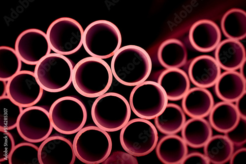 Background of the pink plastic pipes in stacked