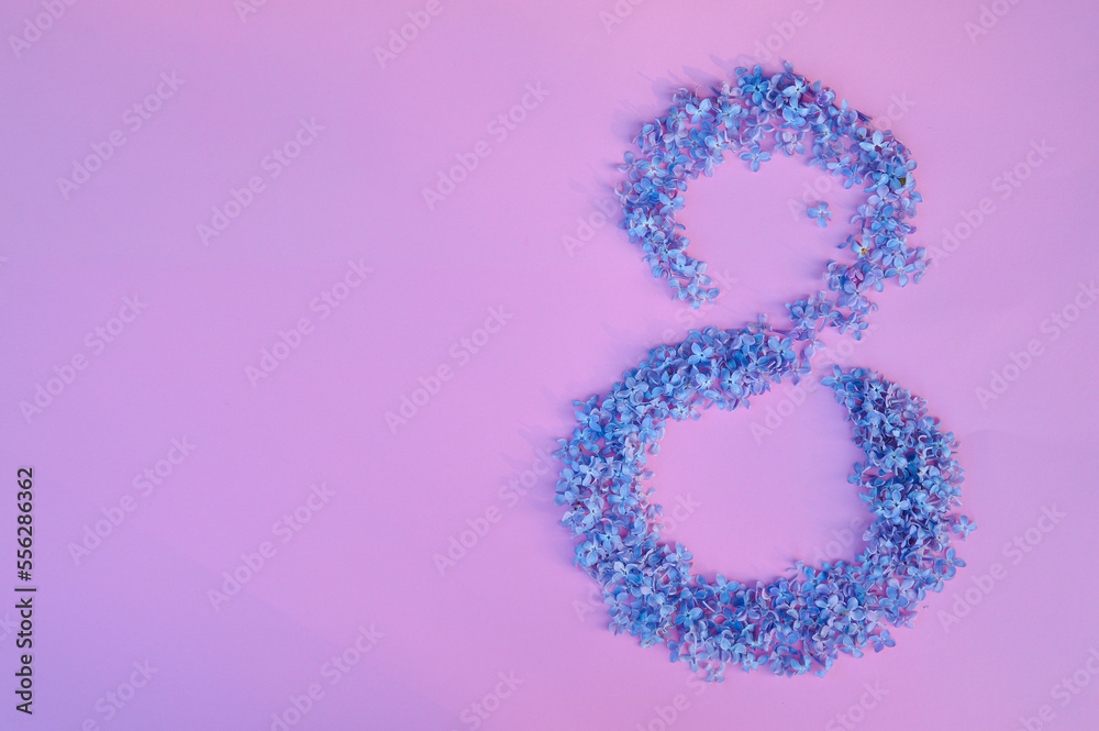 Figure 8 made of flowers on pink background. Happy International Womens Day celebrate on March, congratulatory card Figure 8 made of flowers on pink background. Happy International Womens Day celebrate on March, congratulatory card