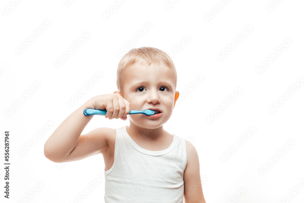 cute boy posing with toothbrush in his mouth on a white background, Happy baby boy with tooth brush. dental hygiene cute boy posing with toothbrush in his mouth on a white background, Happy baby boy with tooth brush. dental hygiene