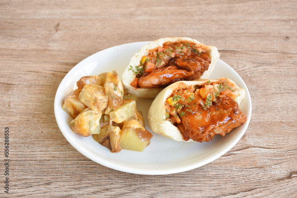 Peta Mexican food stuffed chicken with sauce with baking potato dressing mayonnaise on plate