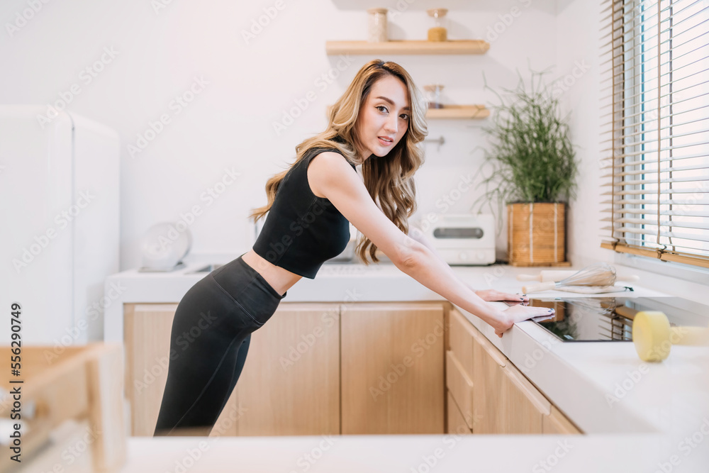 cheerful woman doing push up kitchen. beautiful woman training energy build muscle using body balance technique. happy determined healthy concept woman control exercising flexible body build muscle cheerful woman doing push up kitchen. beautiful woman training energy build muscle using body balance technique. happy determined healthy concept woman control exercising flexible body build muscle