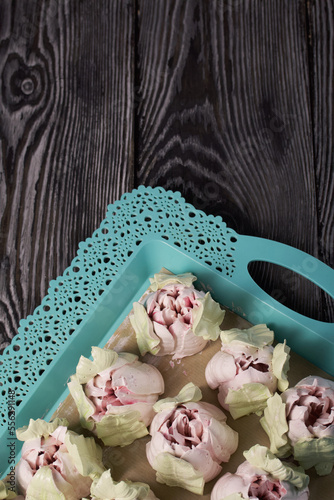 Zephyr tulips. Natural homemade marshmallow. Arranged on a tray. Close-up.