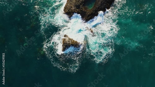 Powerful azure ocean surf on the rocks. Holidays on the islands. Top view