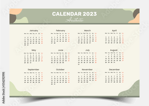 The 2023 Year Calendar Template. A landscape design with an abstract vector artwork in pastel colors. The week begins on Monday every 12 months.