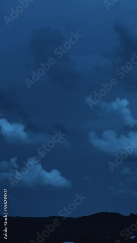 Night scene landscape of big clouds in the dark sky 4k timelapse Vertical video
