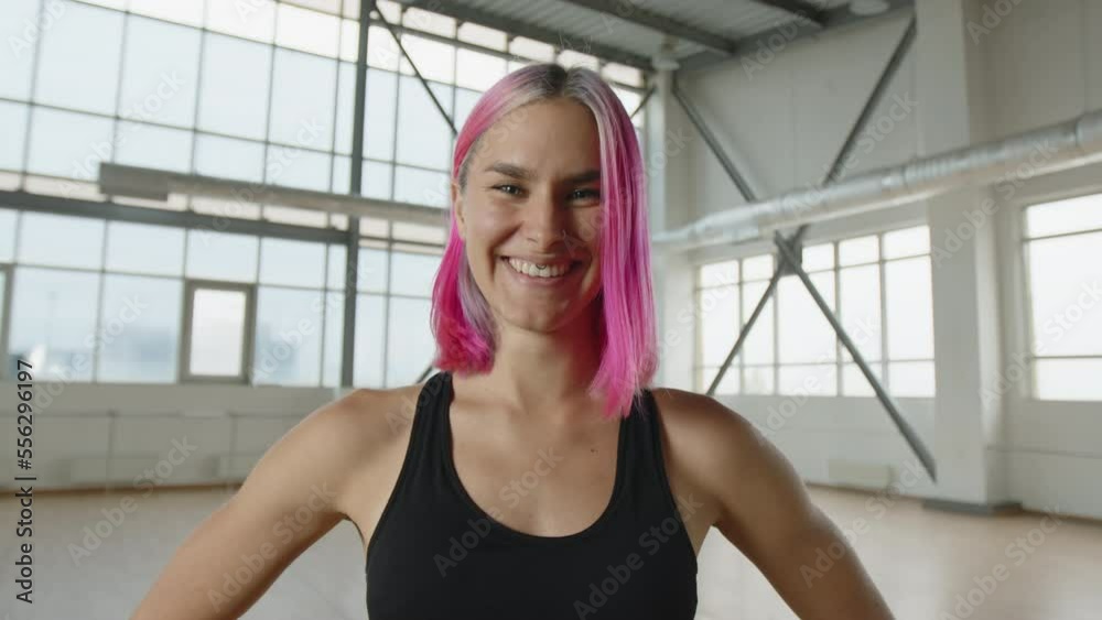 Portrait of a cheerful and beautiful woman in a bright studio. Close-up shot of an active, caucasian girl in her 30s laughing happily. High quality 4k footage Portrait of a cheerful and beautiful woman in a bright studio. Close-up shot of an active, caucasian girl in her 30s laughing happily. High quality 4k footage