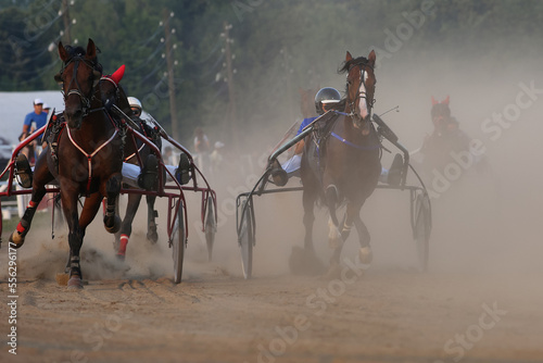 Horse racing in summer, the road is in the dust, Russia, Chuvash Republic