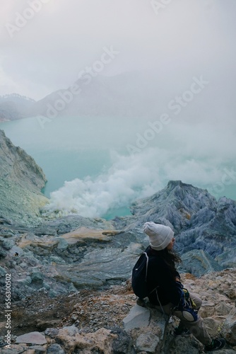 tourist girl inside the crater of Ijen volcano, Java, Indonesia