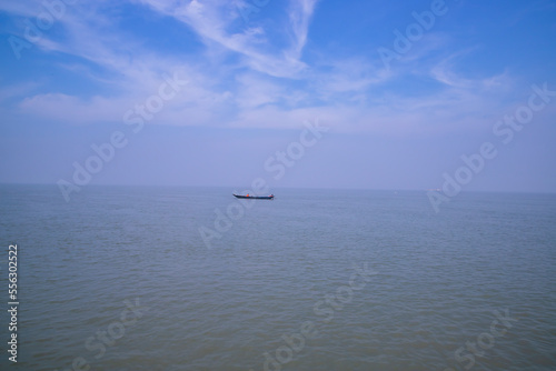 Landscape View of a fishing boat on the  Padma river in Bangladesh © Artyponds