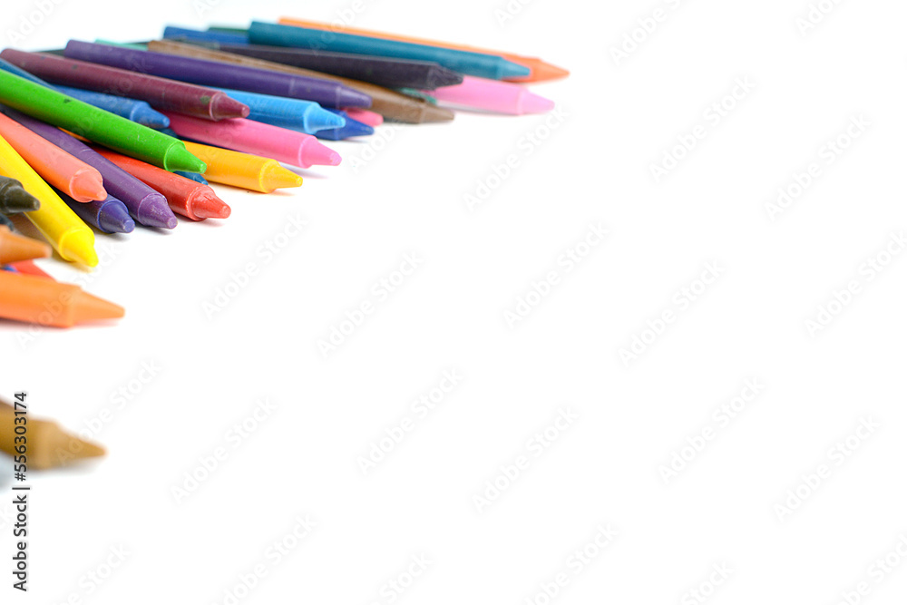 Fototapeta premium Crayons lined up isolated on white background.