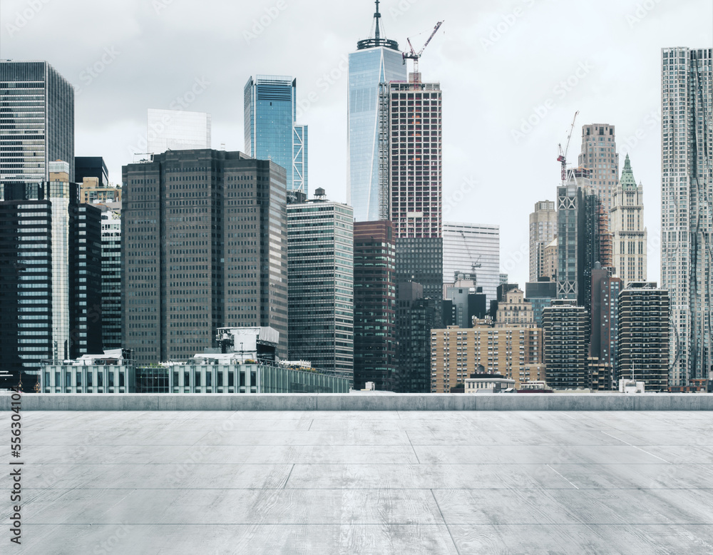 Fototapeta premium Empty concrete dirty rooftop on the background of a beautiful NY city skyline at daytime, mock up