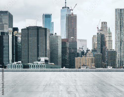 Empty concrete dirty rooftop on the background of a beautiful NY city skyline at daytime  mock up