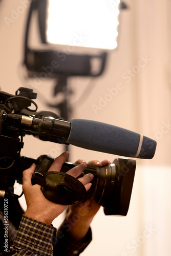 Camerographer's hands with television camera
