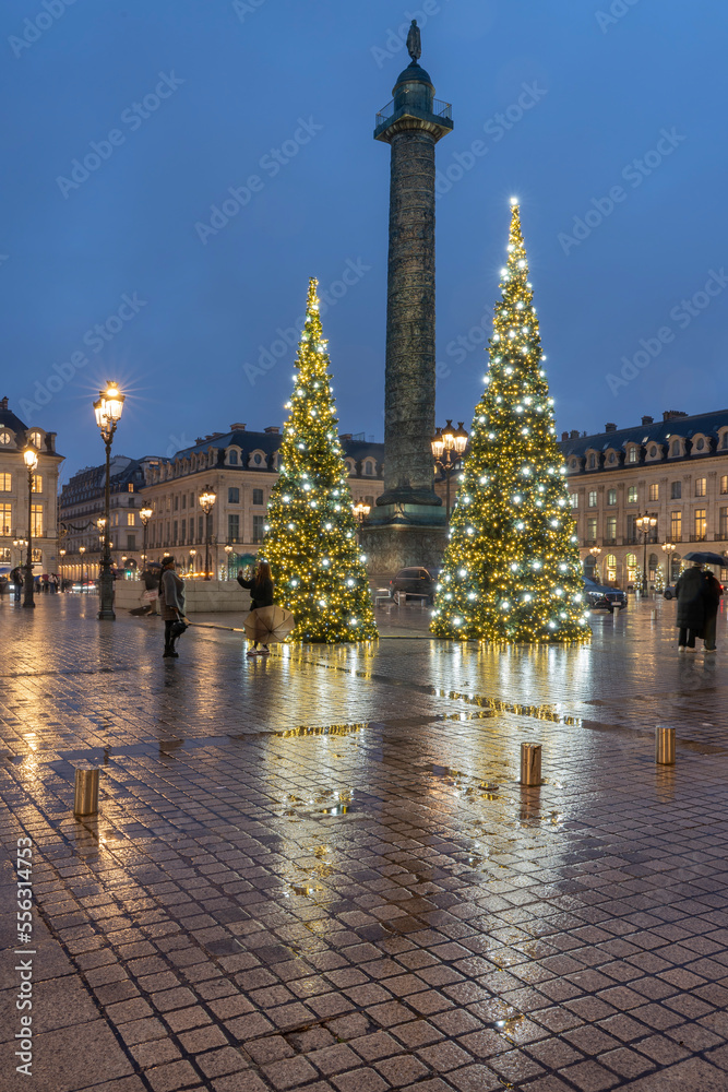 Paris, France - 12 22 2022: Place vendome. View of the place with christmas tree and decoration in a rainy night