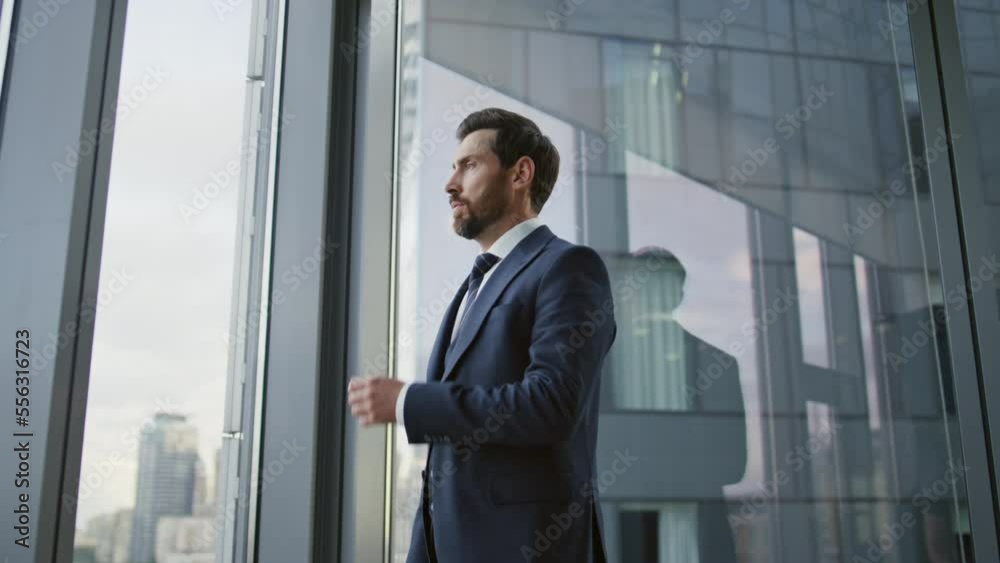 Company employee feeling stress thinking about business perspectives near window