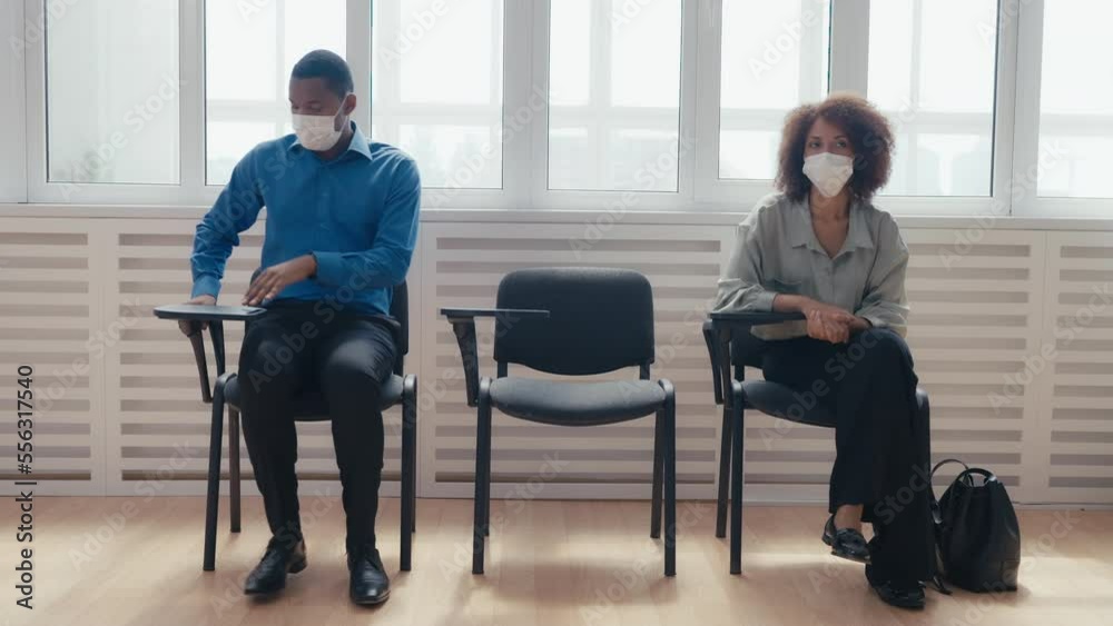 Nervous people in medical masks waiting for bank loan interview, pandemic Nervous people in medical masks waiting for bank loan interview, pandemic
