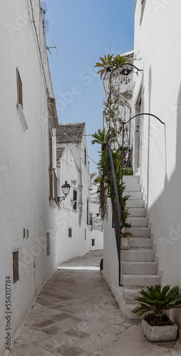 Puglia, Murge, white stone houses, alleys, basoli old town in a summer day. photo