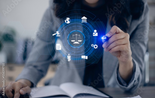 Concepts of Law and Legal services. Lawyer working with law interface icons. Blurred background. 