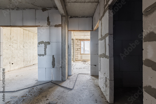 Empty concrete commercial space without finishing with partitions