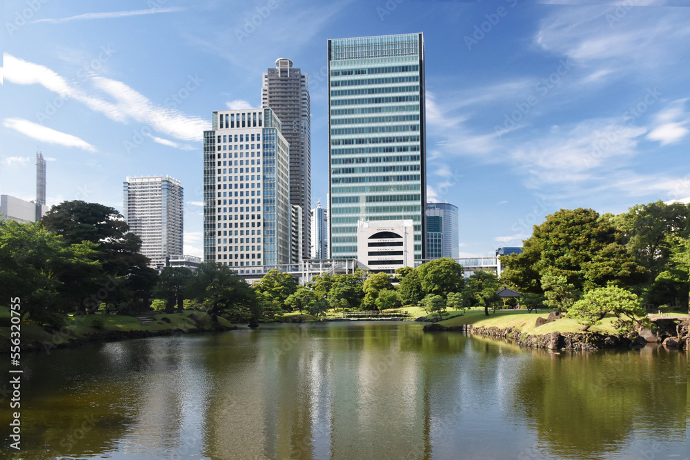 The Kyū Shiba Rikyū Garden - a public garden and former imperial garden in Minato ward in Tokyo, tall skyscrapers in the background