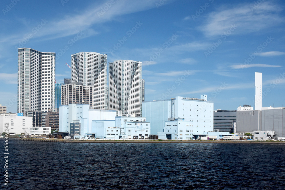 View of Tokyo skyline seen from the shore around Hamamatsucho district, blue sky and sunny weather View of Tokyo skyline seen from the shore around Hamamatsucho district, blue sky and sunny weather