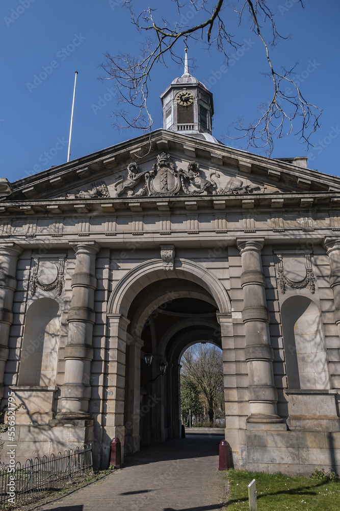 Fototapeta premium Muiderpoort (1770) in Amsterdam is old city gate on the Alexanderplein, gate was part of the fortifications of Amsterdam. Muiderpoort is a national monument. Amsterdam, Netherlands.